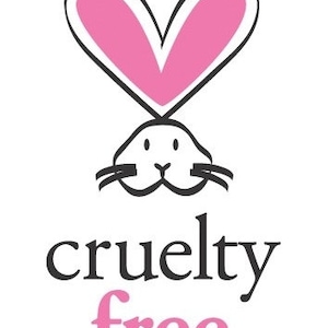 May include: A black and white illustration of a rabbit with a pink heart above its head. The text "cruelty free" is below the rabbit, with "free" in pink.