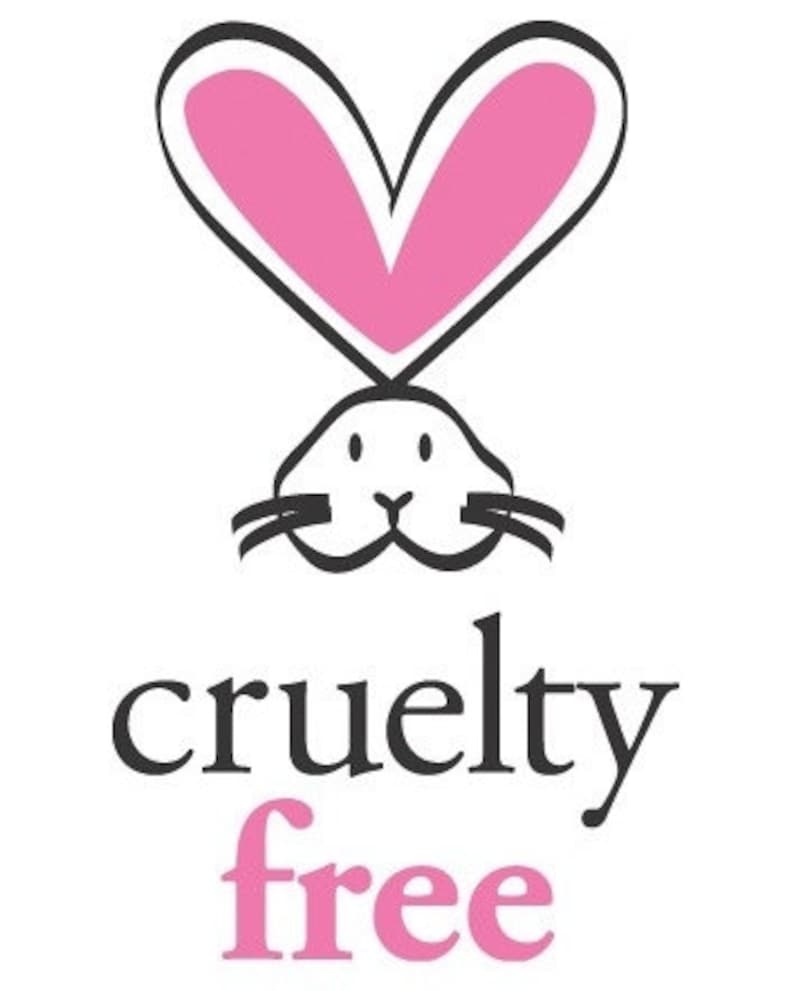 May include: A black and white illustration of a rabbit with a pink heart above its head. The text "cruelty free" is below the rabbit, with "free" in pink.