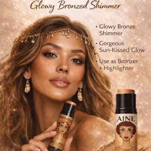 May include: An advertisement for ERZULIE Sun-Goddess bronzing shimmer sticks. The image features a woman with bronzed skin holding a bronzing stick. The text on the stick reads "BRONZING". The image also includes an avocado and text that reads "Glowy Bronzed Shimmer".