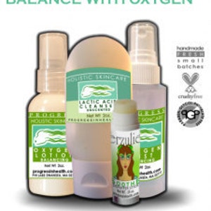May include: A set of four skincare products in white bottles with green and blue labels. The products are labeled "Oxygen Lotion Balancing", "Lactic Acid Cleanser", "Progress Green Essence", and "Progress Green Essence Serum". The bottles are arranged on a white background. The text "handmade fresh small batches" and "cruelty free" are visible in the image.