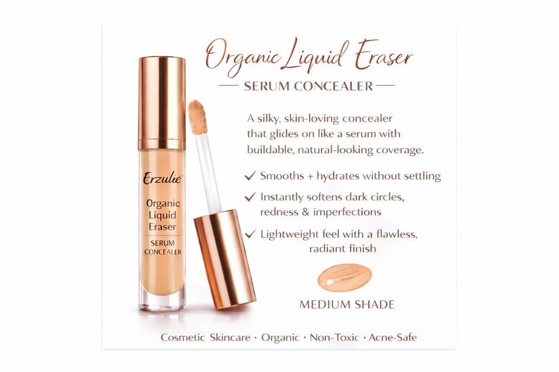 Op de afbeelding: Advertentie voor Erzulie Organic Liquid Eraser Serum Concealer. Het product zit in een heldere glazen fles met een ros&eacute;gouden dop en applicator. De tekst op de fles luidt "Organic Liquid Eraser Serum Concealer". Het product heeft een medium tint.