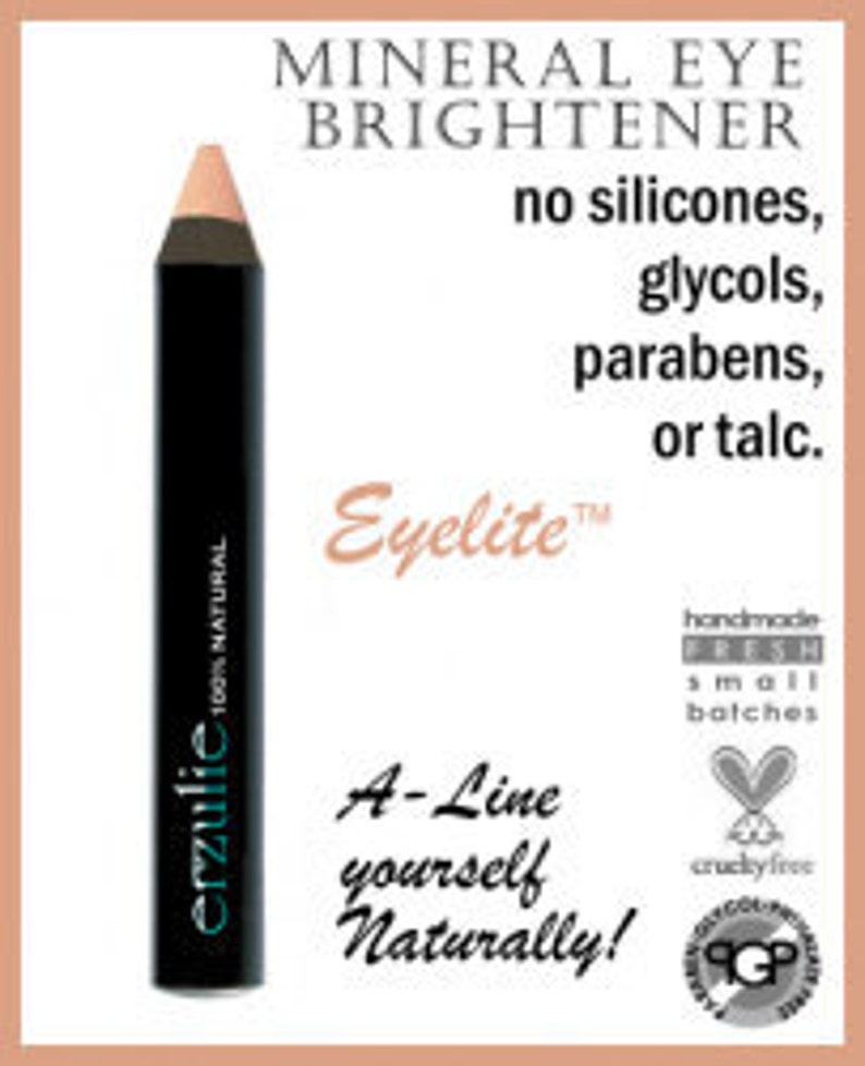 Puede incluir: Un l&aacute;piz negro erzulie 100% NATURAL iluminador de ojos con una punta melocot&oacute;n claro. El texto en el l&aacute;piz dice "Eyelite". La imagen tambi&eacute;n incluye el texto "no silicones, glycols, parabens, or talc."