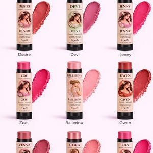 May include: Collection of Erzulie organic lip and cheek colorsticks. Each stick has a different name, such as Desire, Devi, and Jenny. Each stick is paired with a swatch of the color. The sticks have a black base and a colored cap.