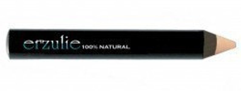 May include: A black eyeliner pencil with the brand name "erzulie" in teal and the text "100% NATURAL" in white. The tip of the pencil is a light beige color.