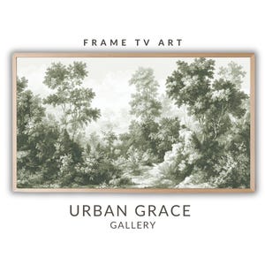 May include: A framed print of a vintage illustration of a forest scene in shades of green. The print features a path winding through the trees and is framed in a light wood frame. The text "FRAME TV ART" appears above the image and "URBAN GRACE GALLERY" appears below the image.