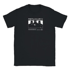 May include: Black t-shirt with a white graphic of three people wearing gas masks. The text "Wulfenstein" is above the graphic and the text "This band is a dream.  Made through music.  Applied by Harrison.  I feel nothing." is below the graphic.