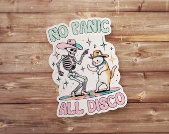 May include: A sticker with a skeleton and a cat wearing cowboy hats dancing on a disco floor. The text reads "No Panic All Disco".