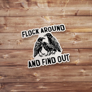 May include: Black and white sticker with three crows and the text "Flock around and find out".