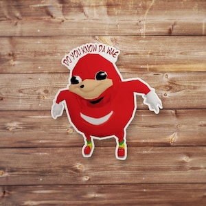 May include: Red cartoon character with a wide smile and large eyes. The character is wearing a red suit and has the text "DO YOU KNOW DA WAE" above it.