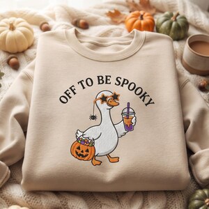 Embroidered Off To Be Spooky Goose Holding Coffee Pumpkin Bucket Unisex Gildan T-Shirt Sweatshirt, Funny Halloween Goose Shirt, Fall Tee