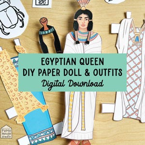 May include: A printable paper doll set featuring an Egyptian queen with different outfits. The doll is wearing a white dress with gold accents and a blue headdress. The outfits include a blue and gold dress with a leopard print, a white dress with a blue and gold pattern, and a white robe with a blue and gold pattern. The text "EGYPTIAN QUEEN DIY PAPER DOLL & OUTFITS Digital Download" is displayed on a green banner.