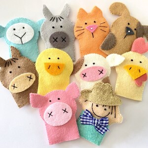 May include: Set of ten felt finger puppets featuring various farm animals, including a pig, cow, horse, chicken, duck, cat, dog, and donkey. The puppets are all brightly colored and have friendly faces.