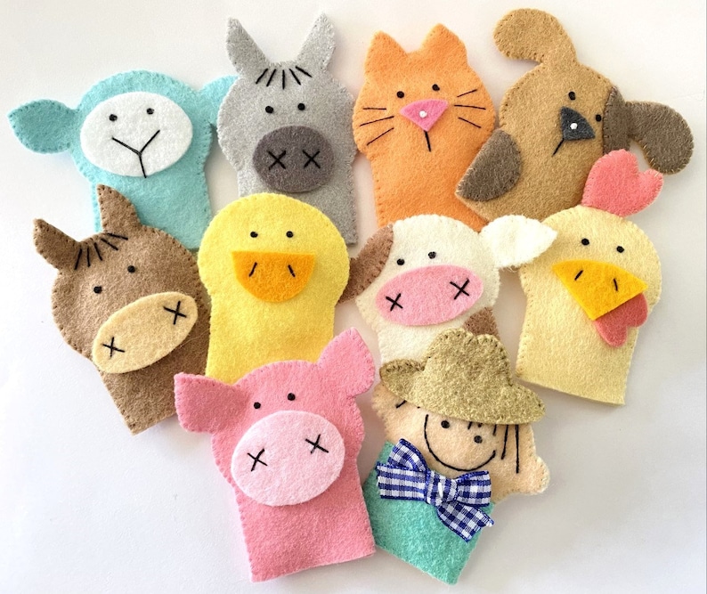 May include: Set of ten felt finger puppets featuring various farm animals, including a pig, cow, horse, chicken, duck, cat, dog, and donkey. The puppets are all brightly colored and have friendly faces.