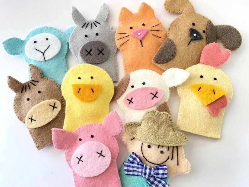 May include: A set of ten felt finger puppets featuring farm animals, including a pig, cow, horse, chicken, duck, sheep, donkey, dog, cat, and a farmer. The puppets are all brightly colored and have embroidered details.