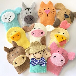 May include: Set of ten felt finger puppets featuring farm animals, including a cow, pig, horse, duck, chicken, sheep, dog, cat, and a farmer. The puppets are all brightly colored and have friendly faces.