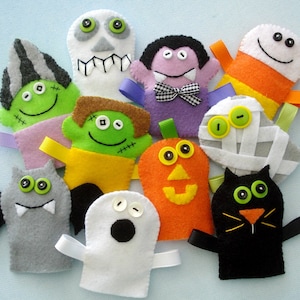 May include: Set of ten felt finger puppets featuring Halloween characters, including a ghost, vampire, mummy, pumpkin, black cat, and Frankenstein. The puppets are colourful and have embroidered details.