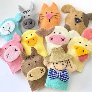 May include: Set of ten felt finger puppets featuring various animals, including a pig, cow, chicken, horse, and a farmer. The puppets are brightly colored and have embroidered details.