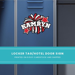 May include: A red and white cheerleading pom-pom with a white star on each side and the name "Kamryn" in white letters on a red banner. The pom-pom is on a blue locker door.