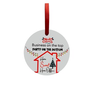 May include: Round white Christmas ornament with a red ribbon. The ornament features a red house with a Christmas tree inside and the text "Home Sweet Home Office". The text "Business on the top Party on the bottom" is also on the ornament.