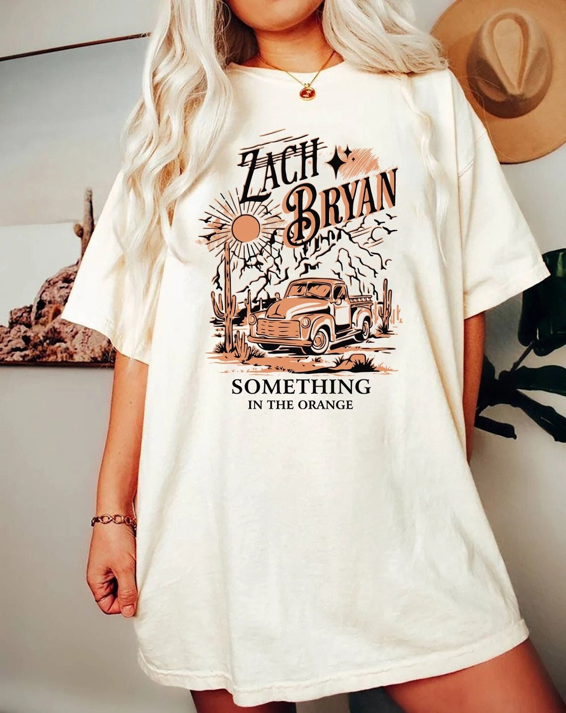 Zach bryan something in the orange sweatshirt zach bryan merch sold by