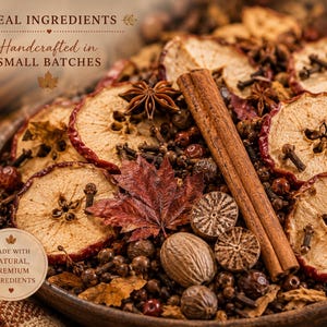 May include: A bowl of potpourri featuring dried apple slices, cinnamon sticks, star anise, whole cloves, nutmeg, and a maple leaf. Text on the image reads: REAL INGREDIENTS, Handcrafted in SMALL BATCHES, MADE WITH NATURAL, PREMIUM INGREDIENTS.