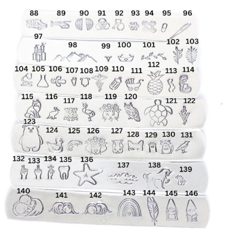 May include: A set of 146 silver metal stamp charms with various designs, including animals, plants, objects, and symbols. The charms are arranged in rows, numbered from 88 to 146.