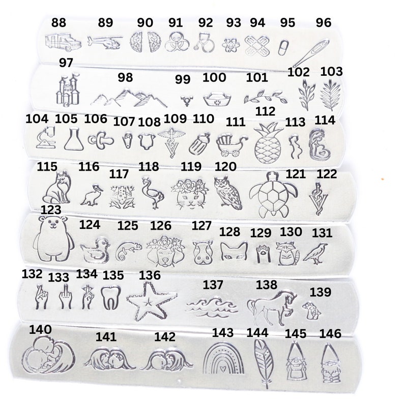 May include: A set of 146 silver charms with various designs, including animals, plants, objects, and symbols. The charms are numbered from 88 to 146.
