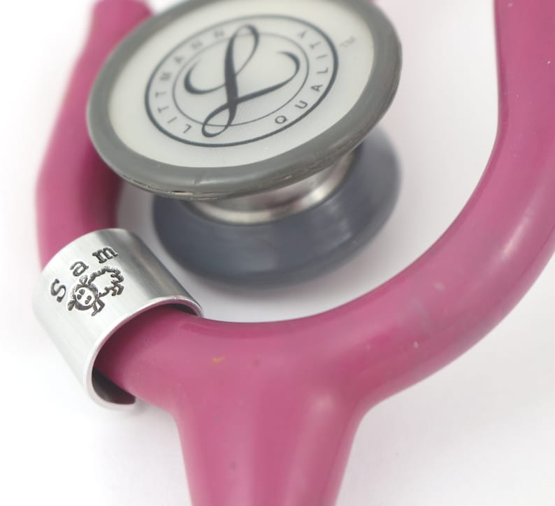 Stethoscope tag for a vet in silver with a name at the top and a picture of a sheep underneath. Personalized charm with your text and animal picture makes a great gift for a veterinarian.