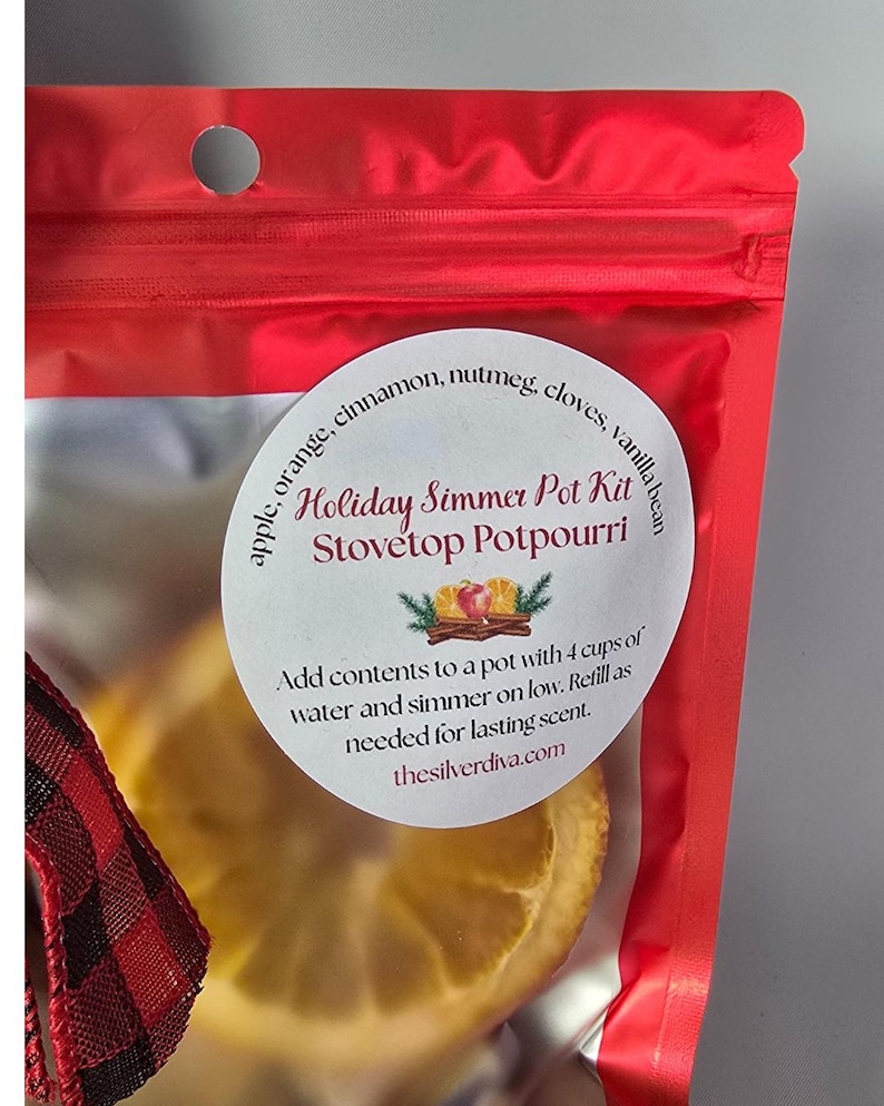 Holiday simmer pot kit white label on a red bag.