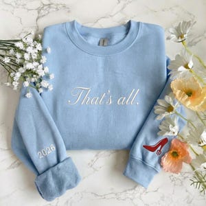 May include: A set of three ceramic mugs with a speckled, matte finish in cream, light grey, and dark grey. Each mug has a simple, minimalist design, suitable for coffee or tea.