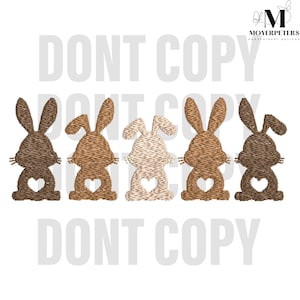May include: Five embroidered bunny rabbits in a row. The bunnies are brown, tan, and white. Each bunny has a heart shape cut out of its back. The text "DONT COPY" appears above and below the bunnies.