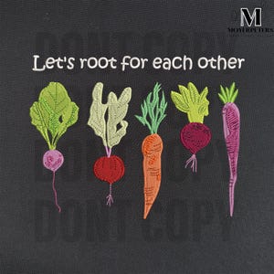 May include: Embroidered design on a dark gray fabric with the text "Let's root for each other" and five embroidered vegetables: a green turnip, a red beet, an orange carrot, a red beet, and a purple turnip.