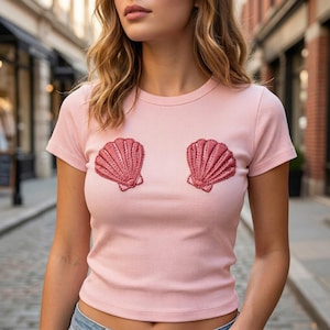 May include: A trio of cream-glazed ceramic mugs, each adorned with a hand-painted floral pattern in blue, green, and yellow hues. The mugs have a rounded form and a practical handle, ideal for enjoying a warm beverage.