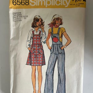 May include: Vintage Simplicity sewing pattern 6568. The pattern features illustrations of two young people wearing overalls and a plaid jumper. The pattern includes two sizes, bust 30 1/2 inches and 32 inches.