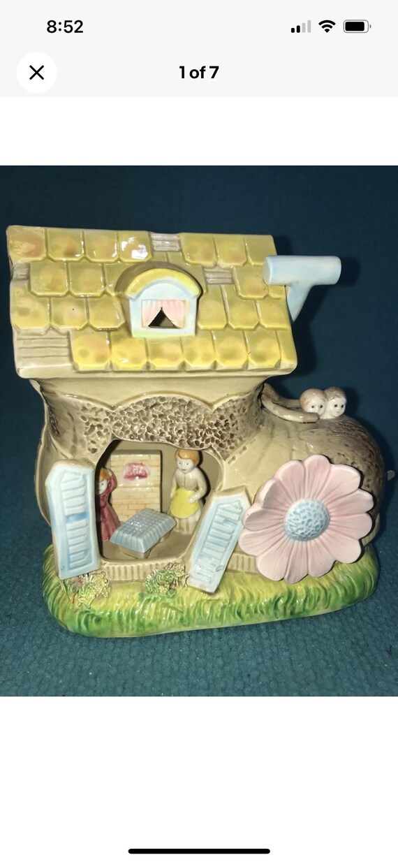 The old woman in the shoe with kids wind up musical movement made in Japan