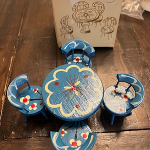 Vintage hand, painted five piece, doll house table with chairs. Blue with white and red floral design.
