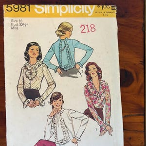 May include: Vintage Simplicity sewing pattern 5981. The pattern features illustrations of blouses with ruffled details. The cover is yellow and white with the number 218. Size 10, bust 32 1/2 inches.