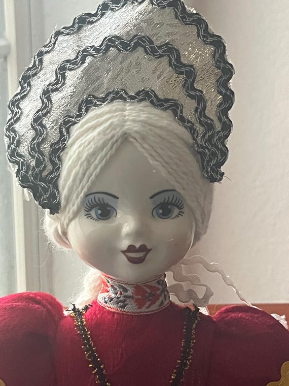 Russian Doll in Traditional Folk Attire Handpainted Porcelain Face.