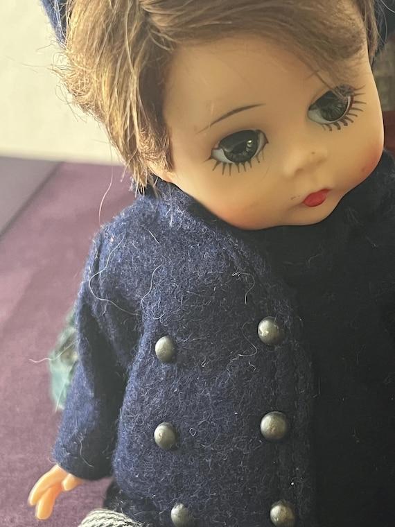 Madame Alexander Doll: Laurie Little-Men Doll w/ Sleepy Eyes. He is Dressed in a Coat, Pants, and Black Socks.