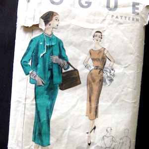 May include: Vintage Vogue sewing pattern featuring two women's dress designs. The first design is a teal green skirt suit with a matching jacket. The second design is a sleeveless brown dress with a white scarf. The pattern is labeled "Vogue Pattern".