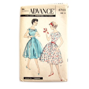 May include: Vintage Advance sewing pattern, size 12, featuring illustrations of two dresses. One dress is solid blue with a bow, the other is floral with a red belt. The pattern is sized for teens.