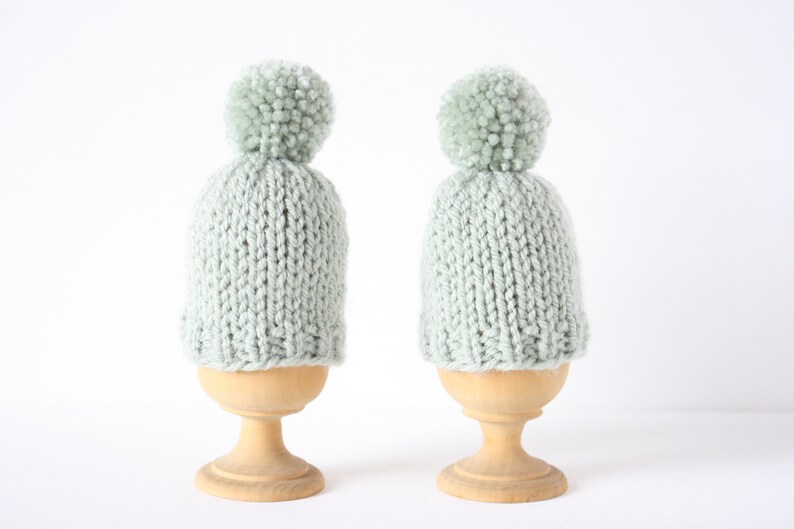 Set of two knitted egg cosies or egg warmers in pink, white, mustard, light green or taupe Light green