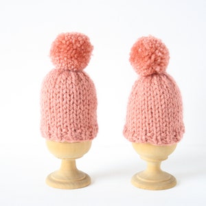 Set of two knitted egg cosies or egg warmers in pink, white, mustard, light green or taupe Pink