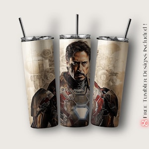 Puede incluir: Un vaso de acero inoxidable con un dise&ntilde;o de Iron Man en un traje rojo y dorado. El fondo es una imagen descolorida de engranajes y maquinaria. El vaso es de 20 onzas.