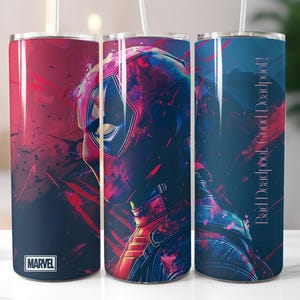 May include: Three stainless steel tumblers with a Deadpool design. The tumblers are blue, red, and black with a graphic of Deadpool's face and the text "Bad Deadpool - Good Deadpool!" on the blue tumbler. The red tumbler has the Marvel logo.