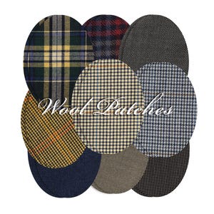 May include: A white ceramic mug with a black handle and the text "But First, Coffee" in a black, handwritten-style font. The mug is on a white surface.