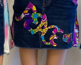 New denim skirt with colorful fabrics. Super stretchy comfy waist. PEACE hand cut applique.  16 inches from waist to hem.