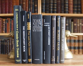 Collection of eight hardcover books in black bindings - Free US Shipping