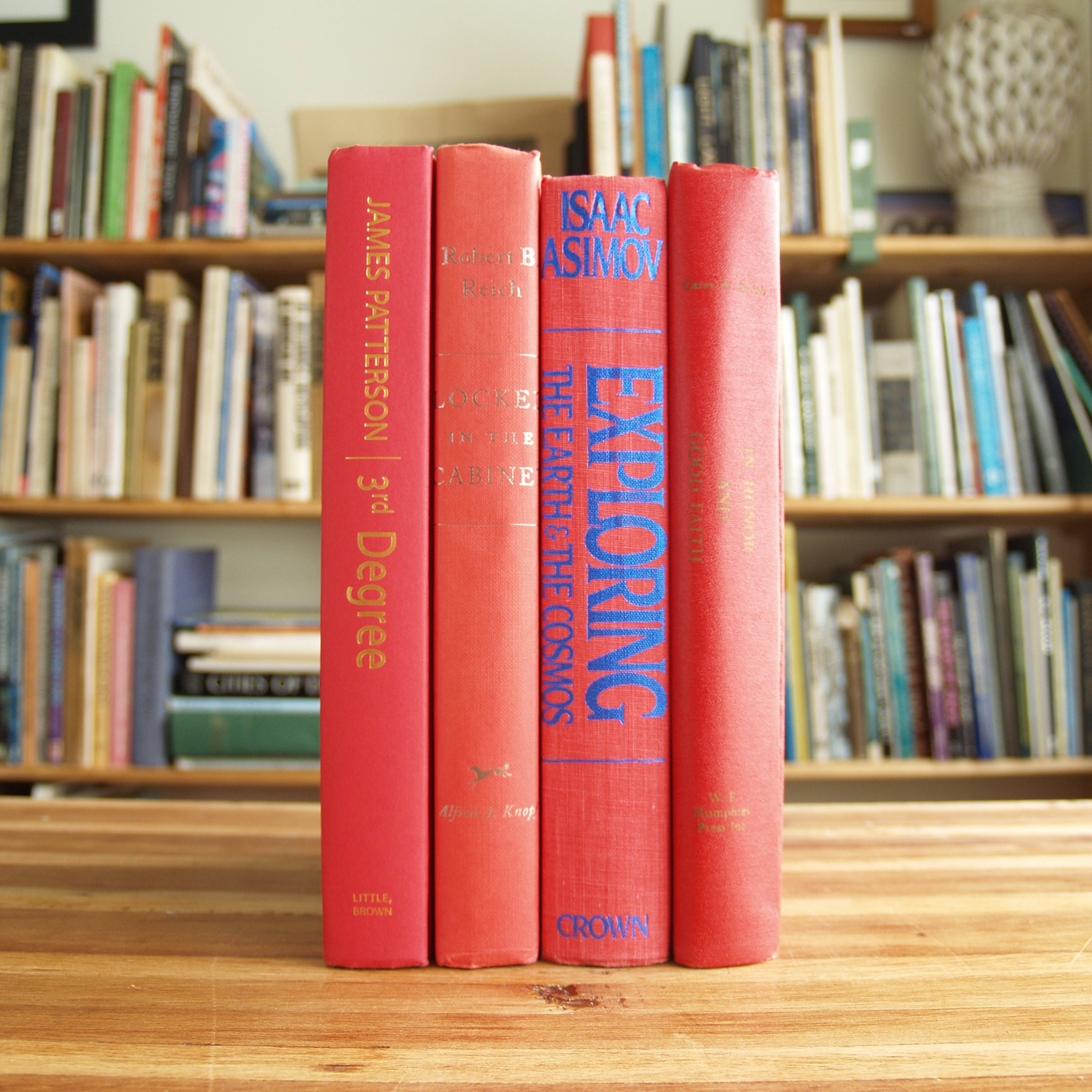Decorative Collection of Eight Hardcover Books With Red