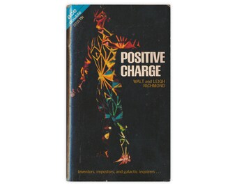 May include: A vintage paperback book cover with a black background and a colourful illustration of a person. The title of the book is "Positive Charge" by Walt and Leigh Richmond. The text below the title reads "Inventors, impostors, and galactic inquirers..."